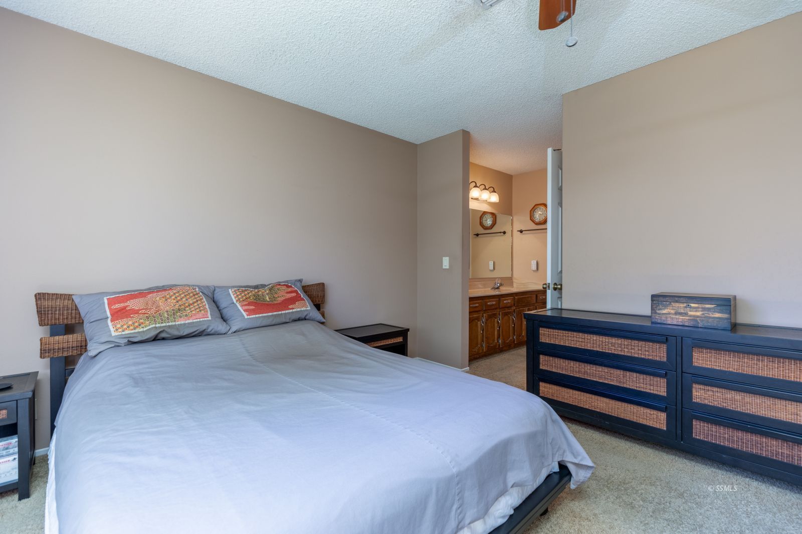 213 Washington Way Ridgecrest, CA 93555 - Photo 14 of 25 a bedroom with a bed and cabinets
