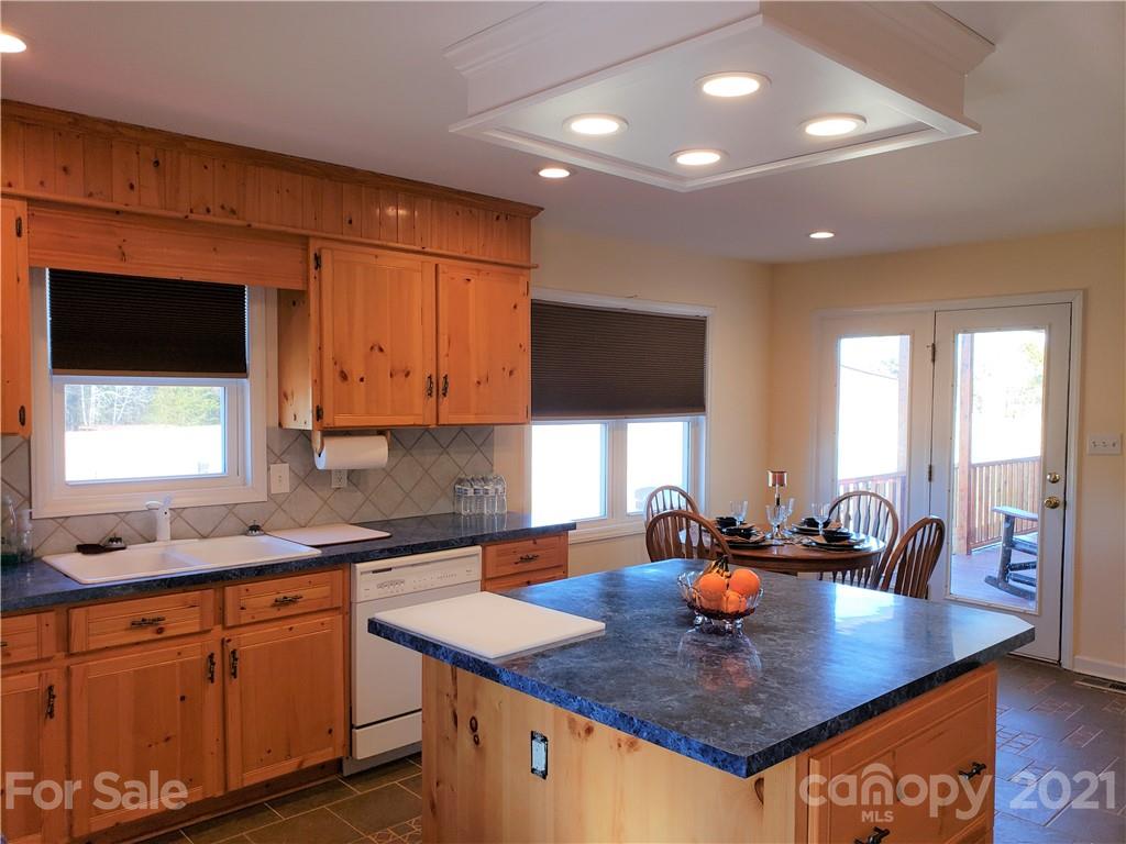 1770 Legion Road Hickory Grove, SC 29717 - Photo 15 of 48 a kitchen with stainless steel appliances granite countertop a sink a stove and a refrigerator