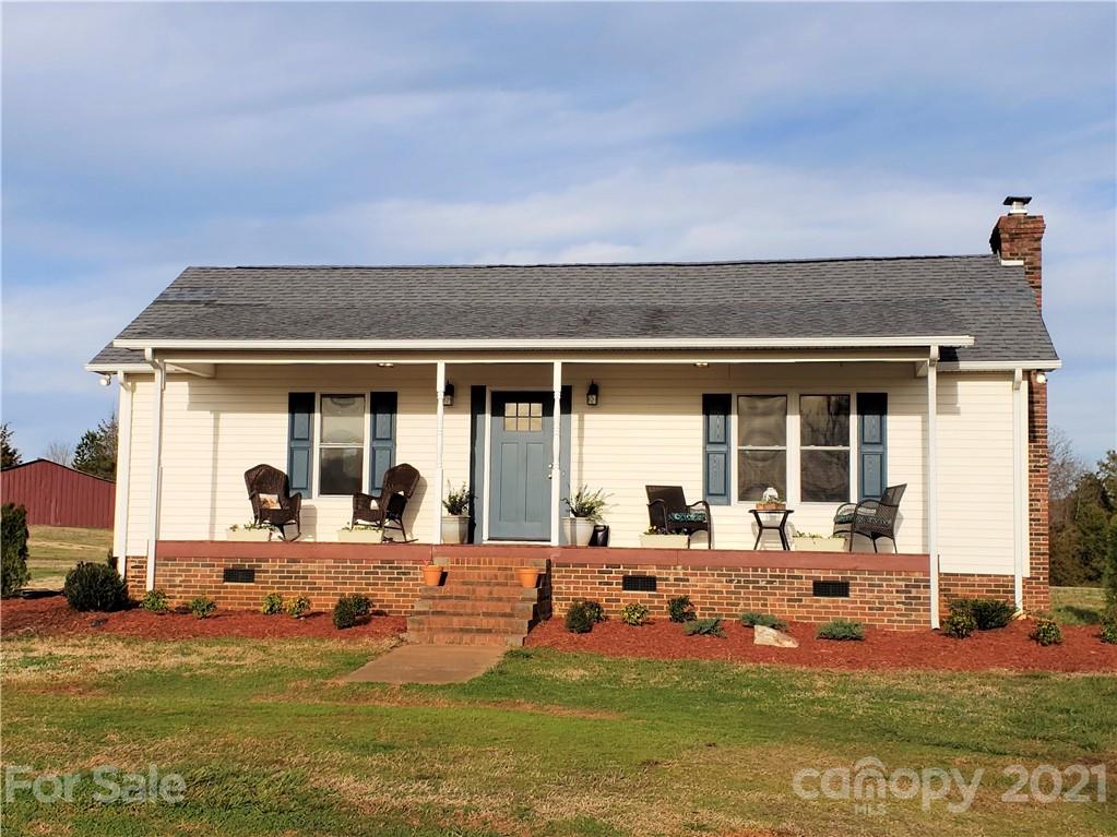 1770 Legion Road Hickory Grove, SC 29717 - Photo 7 of 48 a front view of a house with swimming pool and chairs
