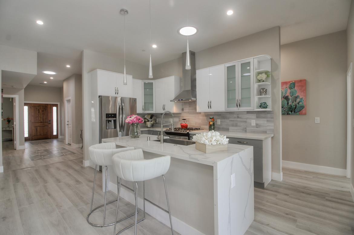 856 Howe Street San Mateo, CA 94401 - Photo 12 of 32 a kitchen with stainless steel appliances granite countertop a sink and a refrigerator