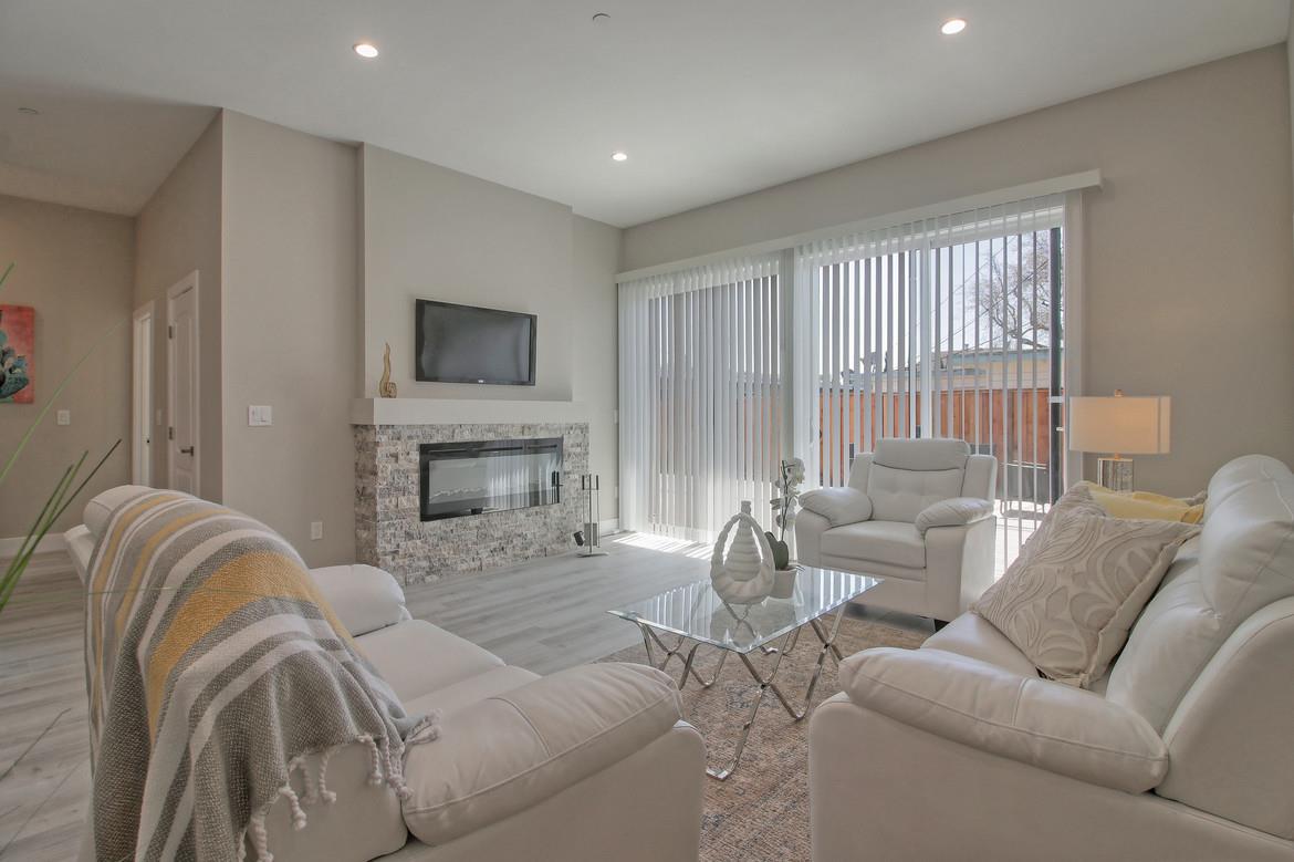 856 Howe Street San Mateo, CA 94401 - Photo 13 of 32 a living room with furniture fireplace and a flat screen tv