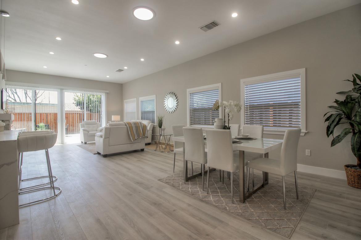 856 Howe Street San Mateo, CA 94401 - Photo 15 of 32 a living room with fireplace furniture and a wooden floor