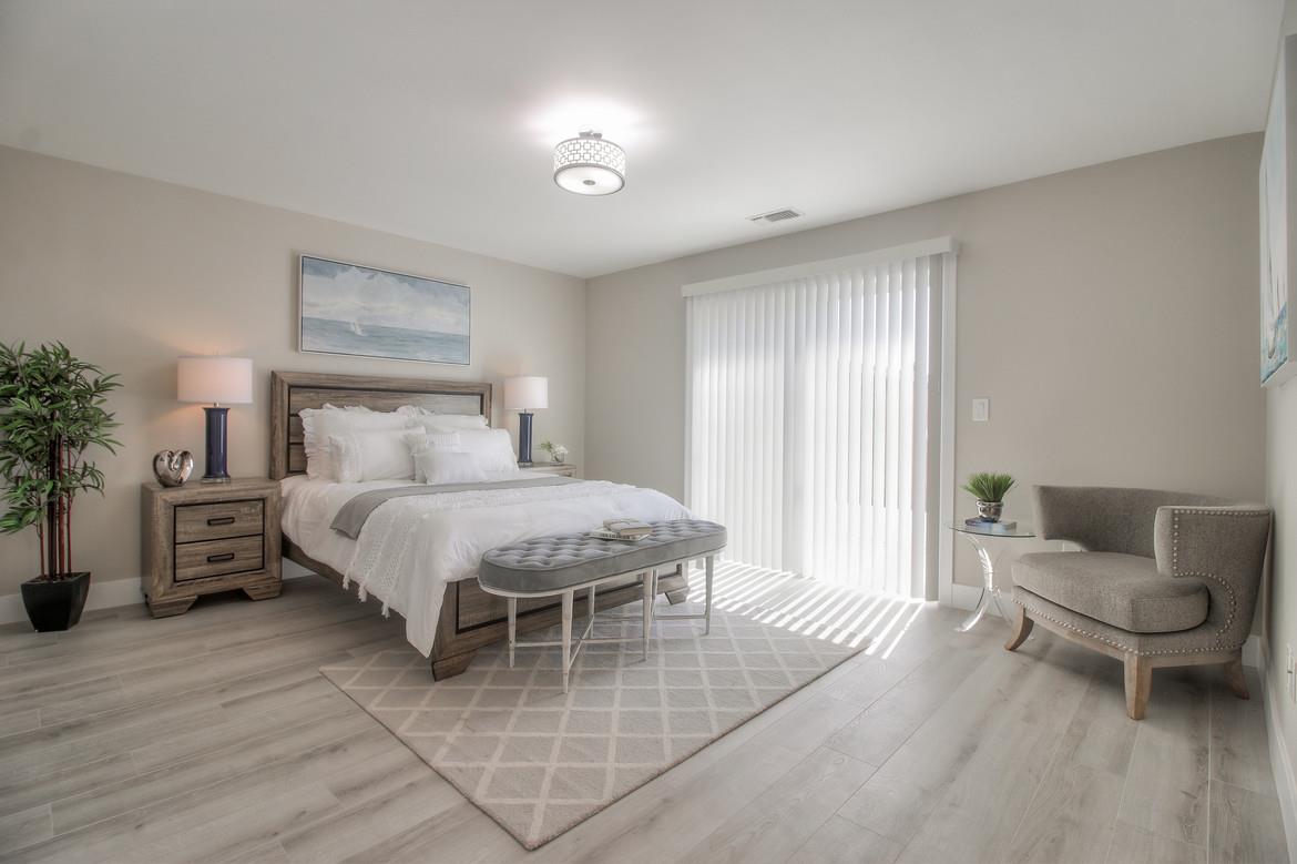 856 Howe Street San Mateo, CA 94401 - Photo 17 of 32 a bedroom with a bed and glass window