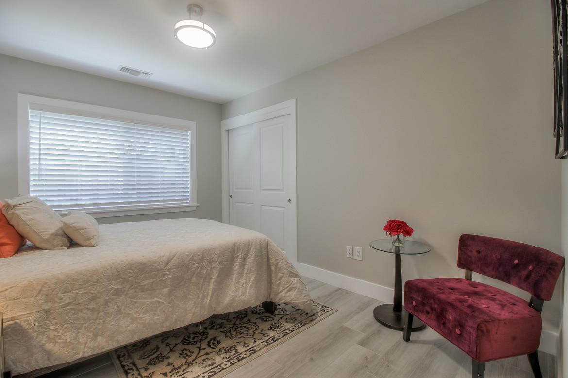 856 Howe Street San Mateo, CA 94401 - Photo 23 of 32 a bedroom with a bed and a couch