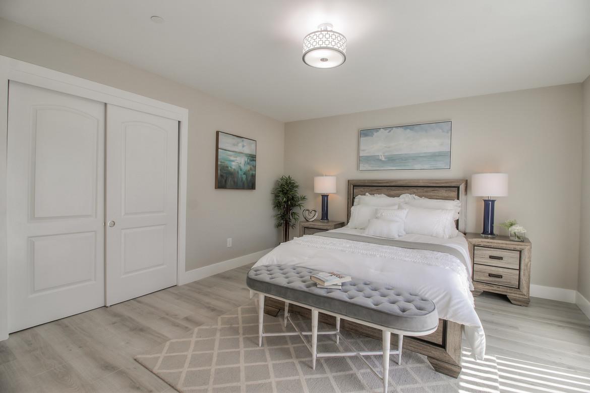 856 Howe Street San Mateo, CA 94401 - Photo 26 of 32 a bedroom with a bed and a table in it