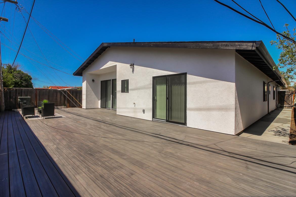 856 Howe Street San Mateo, CA 94401 - Photo 30 of 32 a view of house with wooden deck and living room