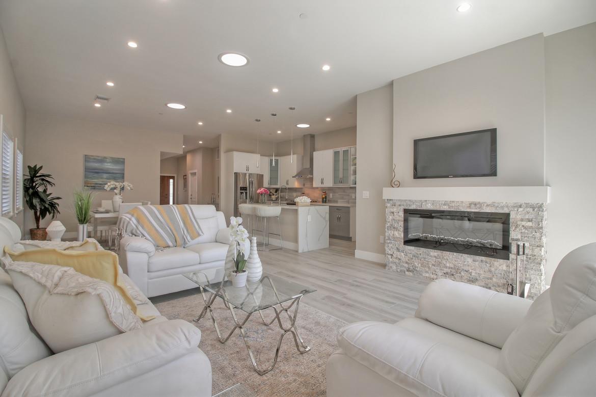 856 Howe Street San Mateo, CA 94401 - Photo 8 of 32 a living room with furniture and a fireplace