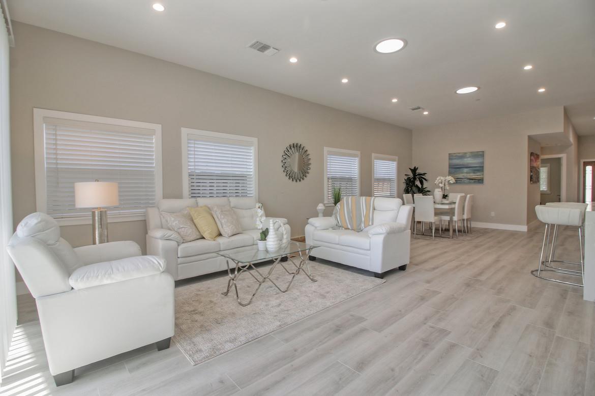 856 Howe Street San Mateo, CA 94401 - Photo 10 of 32 a living room with furniture and a wooden floor