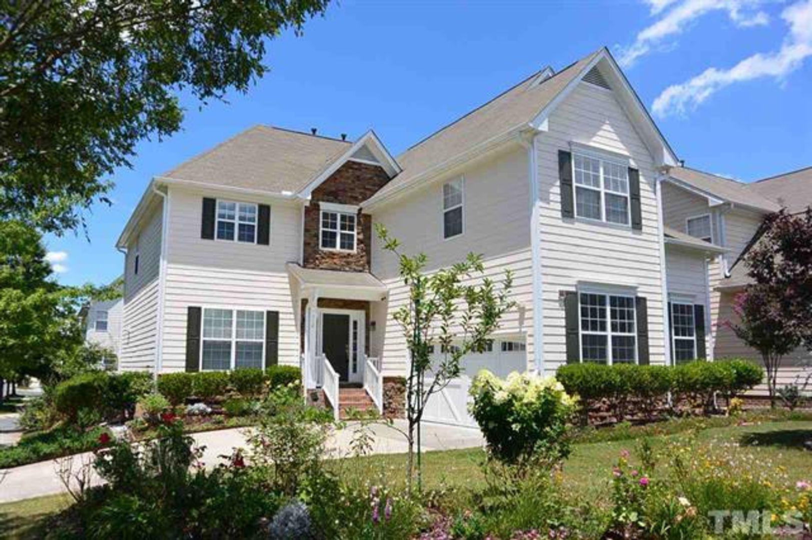 712 CALLAY Hill Way Cary, NC 27519 - Photo 1 of 18 a front view of a house with a yard