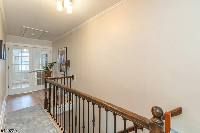 a view of a hallway with paintings on the wall