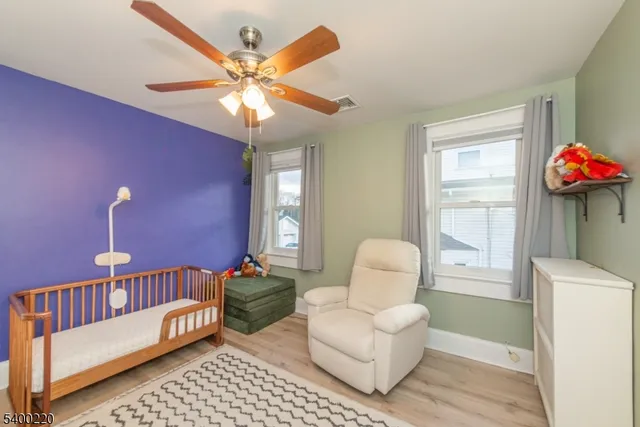 a bedroom with furniture and a window