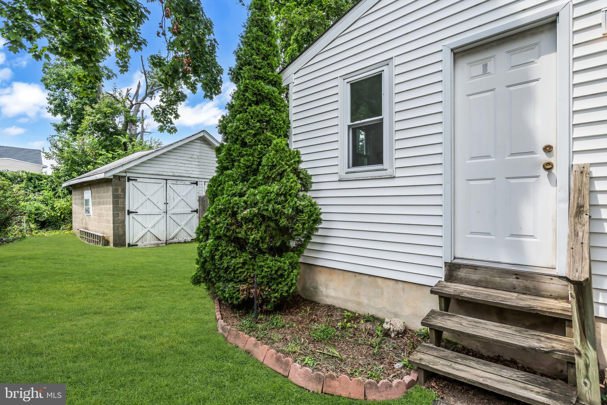 110 Delaware Avenue Riverside, NJ 08075 - Photo 22 of 25 Charming home with lush greenery.