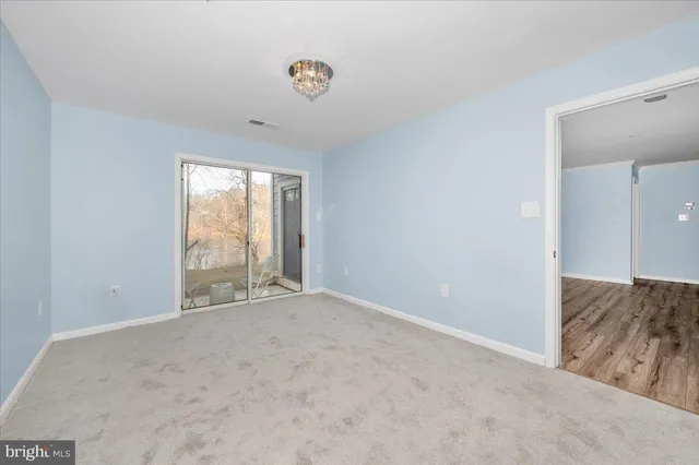 a view of an empty room and window