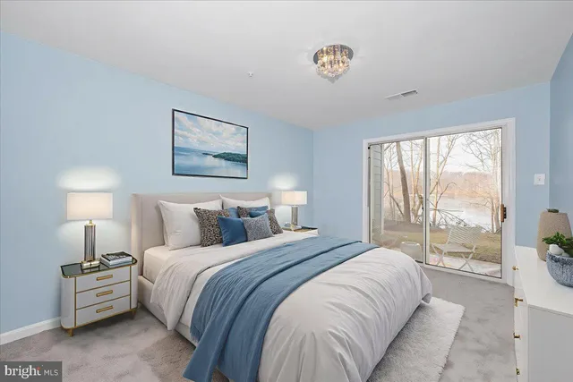 a bedroom with a large bed and a large window