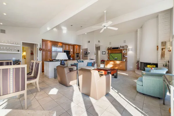 a kitchen with stainless steel appliances granite countertop a stove and a refrigerator