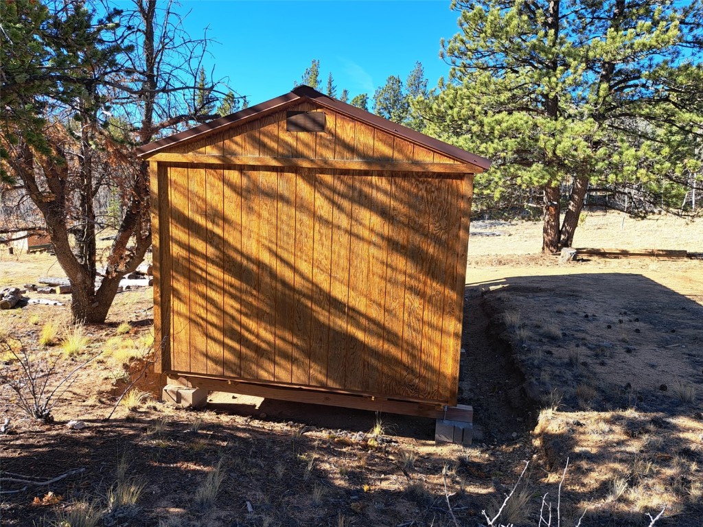 209 Crooked Rock Path Como, CO 80456 - Photo 12 of 17 a view of a house with a yard
