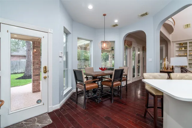 a view of a dining room with furniture window and wooden floor