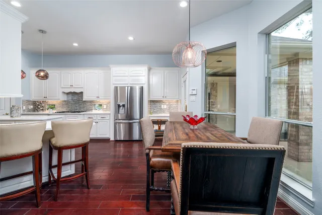 a kitchen with a table and chairs in it