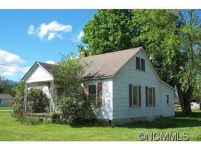 26 Harry Rogers Road Canton, NC 28716 - Photo 1 of 13 a front view of a house with a garden