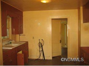 26 Harry Rogers Road Canton, NC 28716 - Photo 7 of 13 a bathroom with a sink and a mirror
