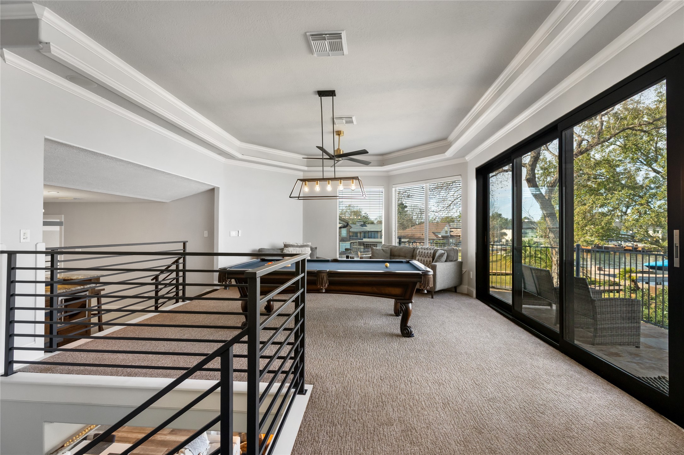 11706 Edgewater Court Montgomery, TX 77356 - Photo 36 of 50 Game room with pool table and 3 panel tuck away doors