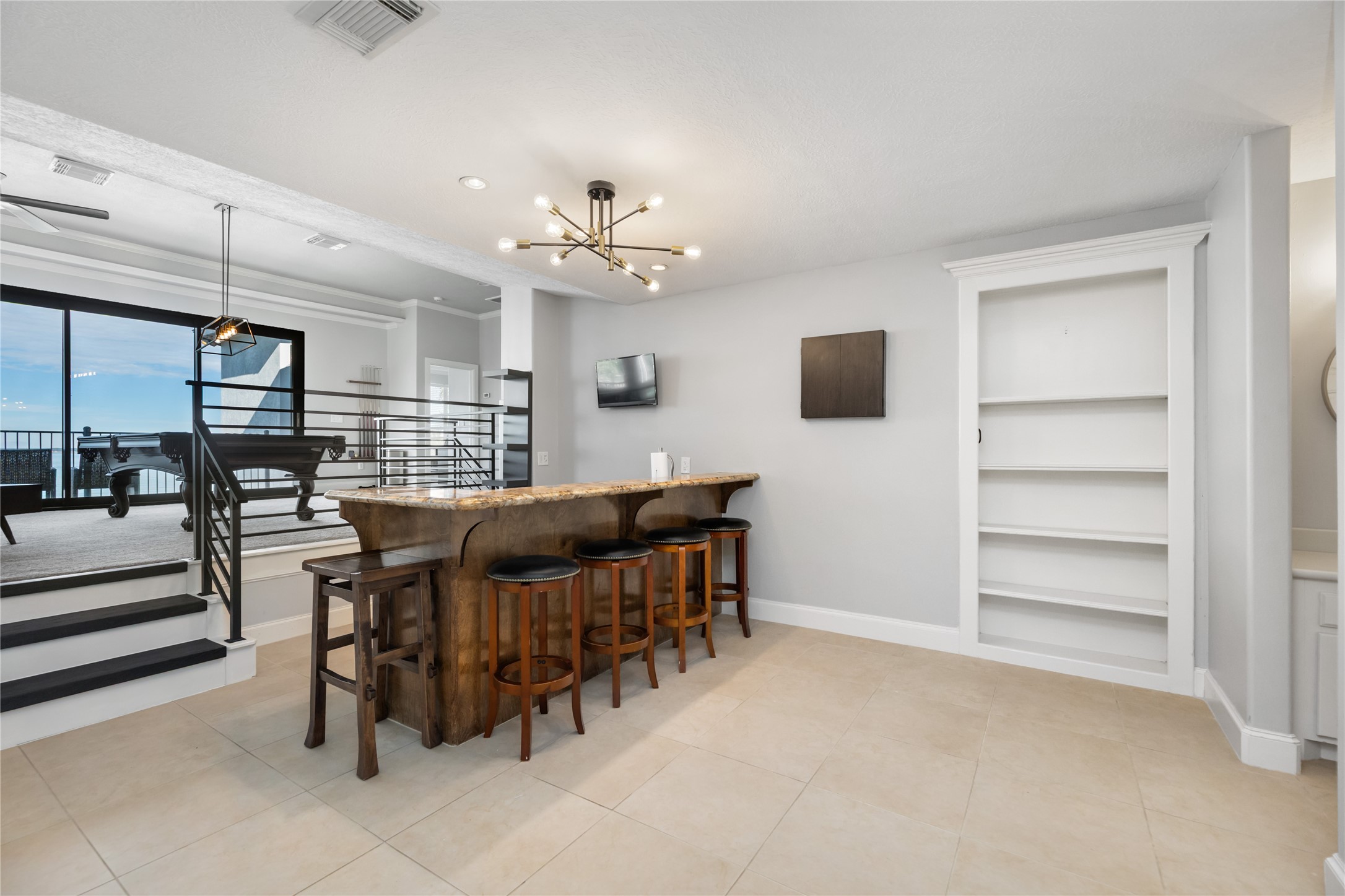 11706 Edgewater Court Montgomery, TX 77356 - Photo 39 of 50 Bookshelf secret door entering the home theatre and gy,