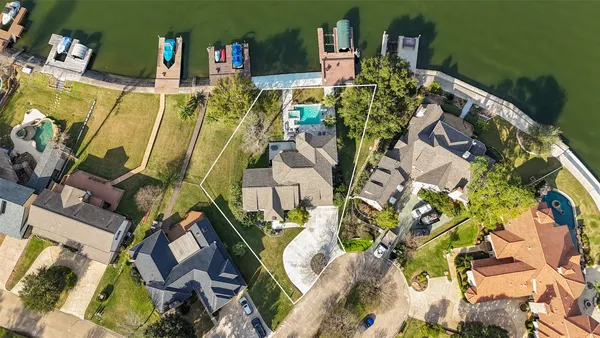 an aerial view of a house with a swimming pool