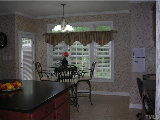 12128 Pawleys Mill Circle Raleigh, NC 27614 - Photo 17 of 25 Enjoy your morning coffee in this bright shiny space overlooking the backyard. Breakfast Area