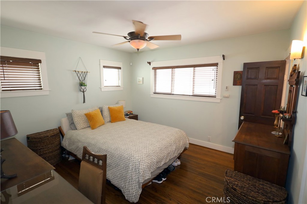 226 Orizaba Avenue Long Beach, CA 90803 - Photo 18 of 39 a bedroom with a bed and wooden floor