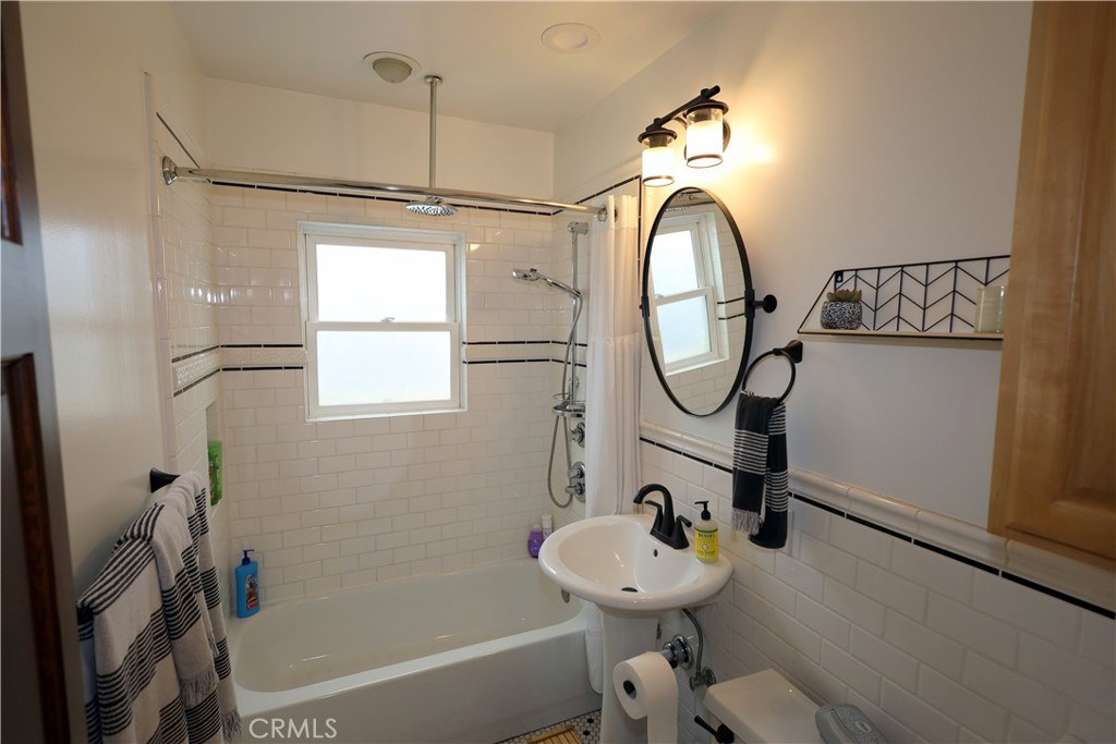 226 Orizaba Avenue Long Beach, CA 90803 - Photo 26 of 39 a bathroom with a sink toilet and a mirror