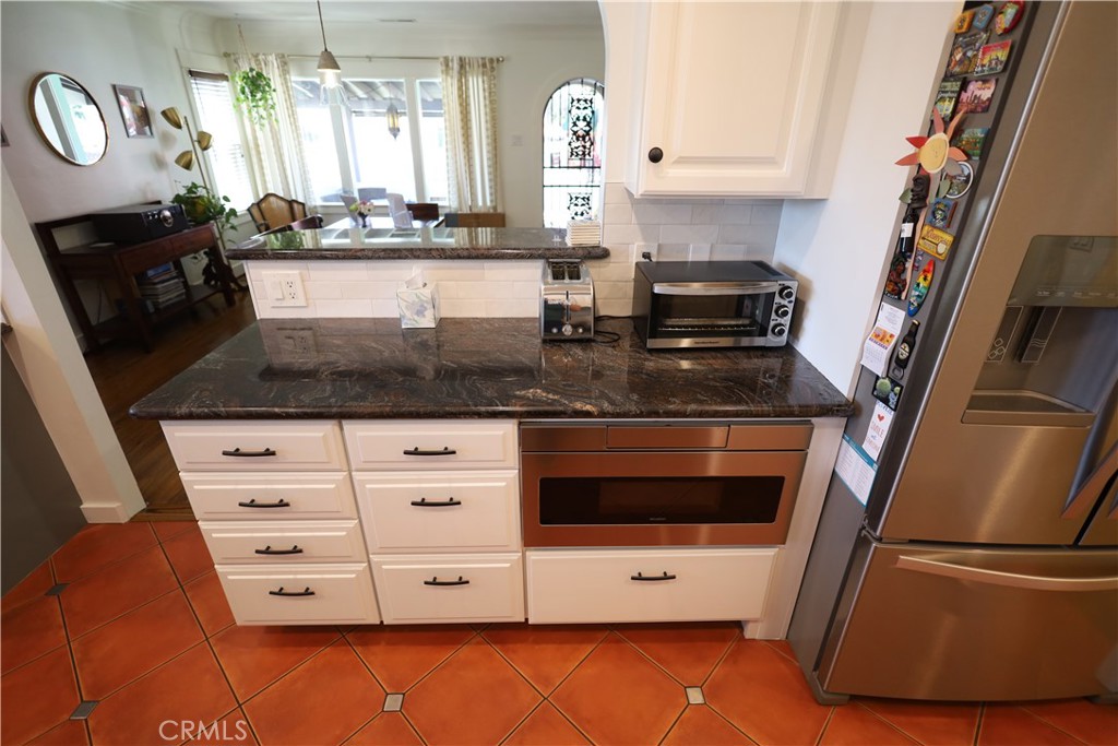 226 Orizaba Avenue Long Beach, CA 90803 - Photo 39 of 39 a kitchen with stainless steel appliances granite countertop a stove a sink and a refrigerator