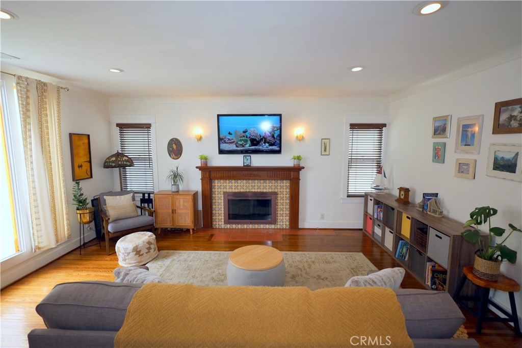 226 Orizaba Avenue Long Beach, CA 90803 - Photo 4 of 39 a living room with furniture and a fireplace