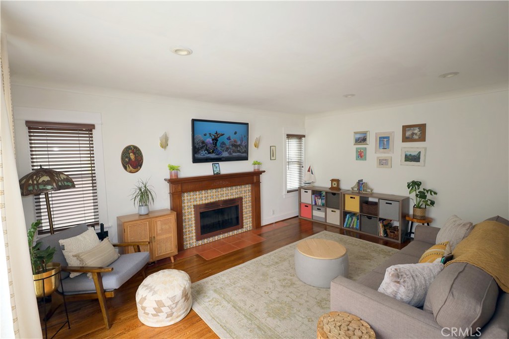226 Orizaba Avenue Long Beach, CA 90803 - Photo 6 of 39 a living room with furniture and a fireplace