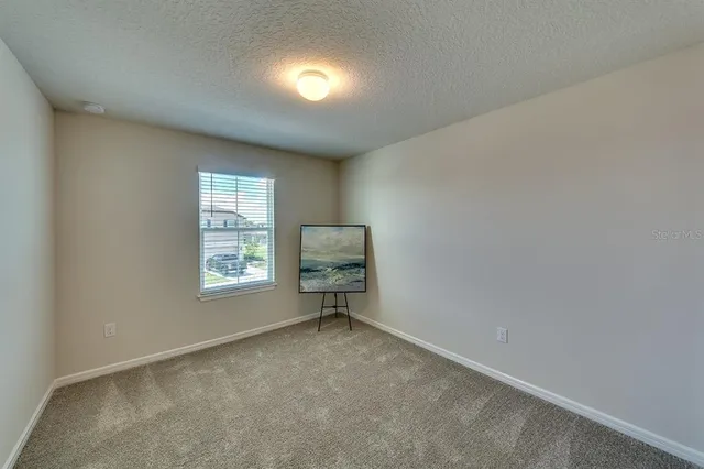a bathroom with a sink a toilet a mirror and shower