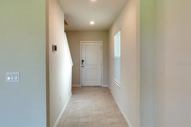 a view of a hallway with a white walls