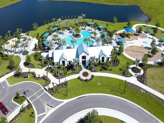 a white house with yard in front of it