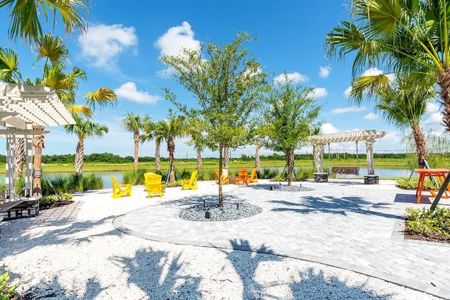 a front view of a house with a garden and yard