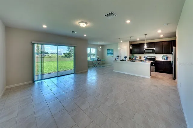 a view of a kitchen with a sink and a stove top oven