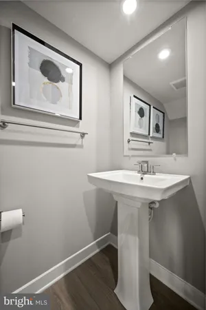 a white toilet sitting next to a bathroom sink