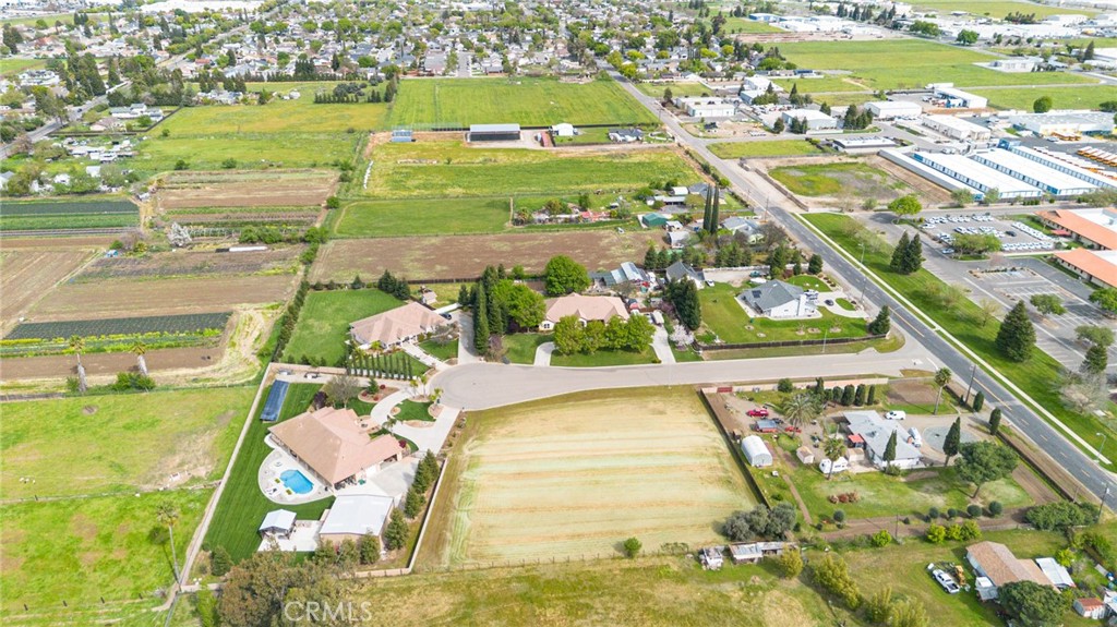 965 Bryant Court Merced, CA 95341 - Photo 8 of 12 an aerial view of a pool patio swimming pool and outdoor seating
