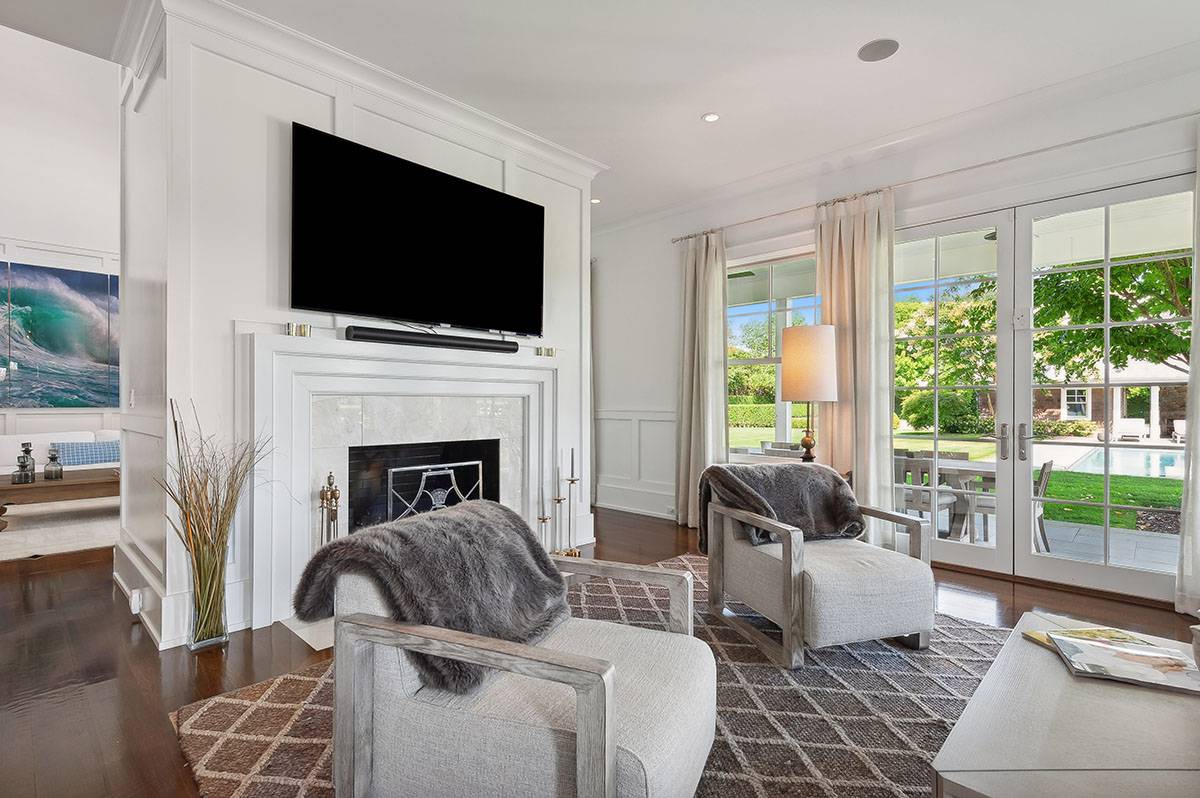 63 Newlight Lane Bridgehampton, NY 11976 - Photo 8 of 37 a living room with furniture fireplace and flat screen tv