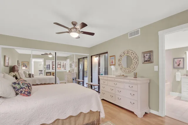 a bedroom with a large bed and a dresser