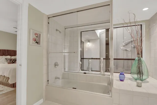 a bathroom with a bathtub and a shower