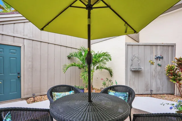 a view of a balcony with furniture