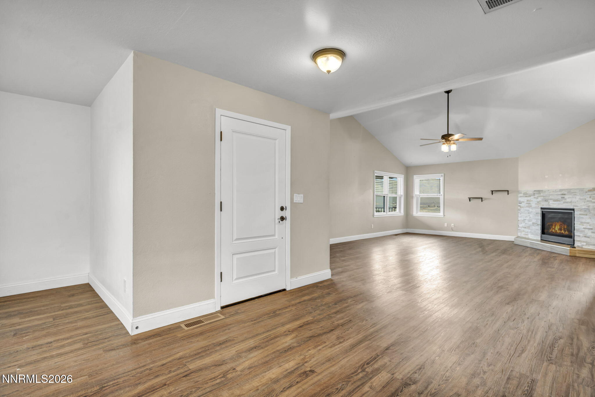 45 Arabian Way Reno, NV 89508 - Photo 17 of 44 an empty room with wooden floor and windows