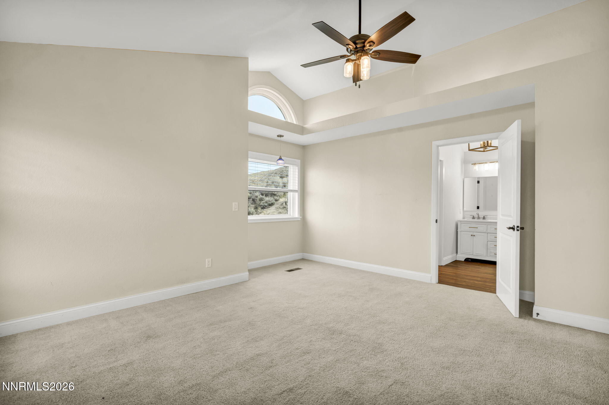 45 Arabian Way Reno, NV 89508 - Photo 31 of 44 an empty room with chandelier fan and windows