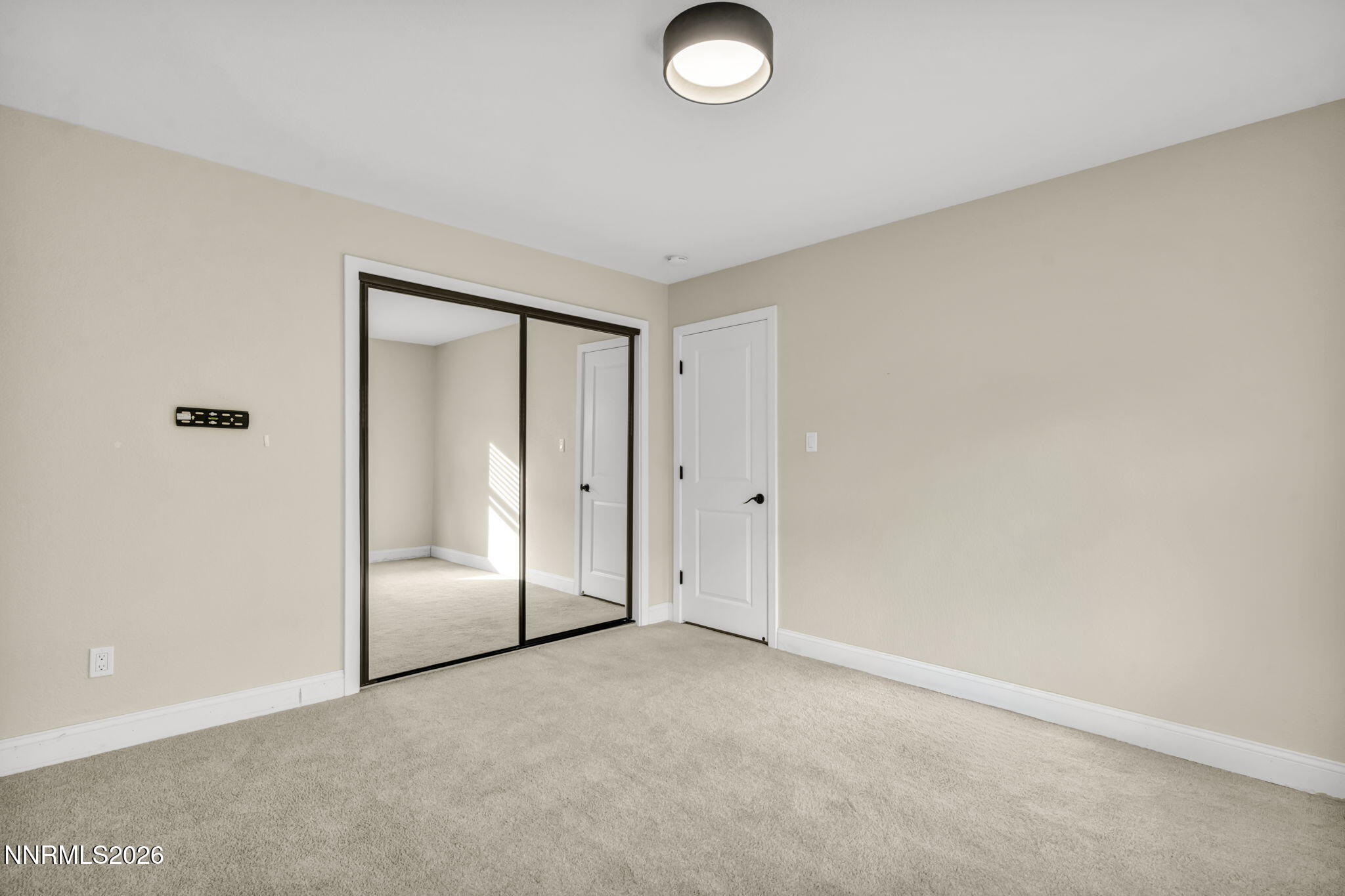 45 Arabian Way Reno, NV 89508 - Photo 35 of 44 an empty room with sliding door and mirror