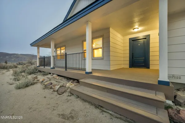 a view of a balcony with wooden floor