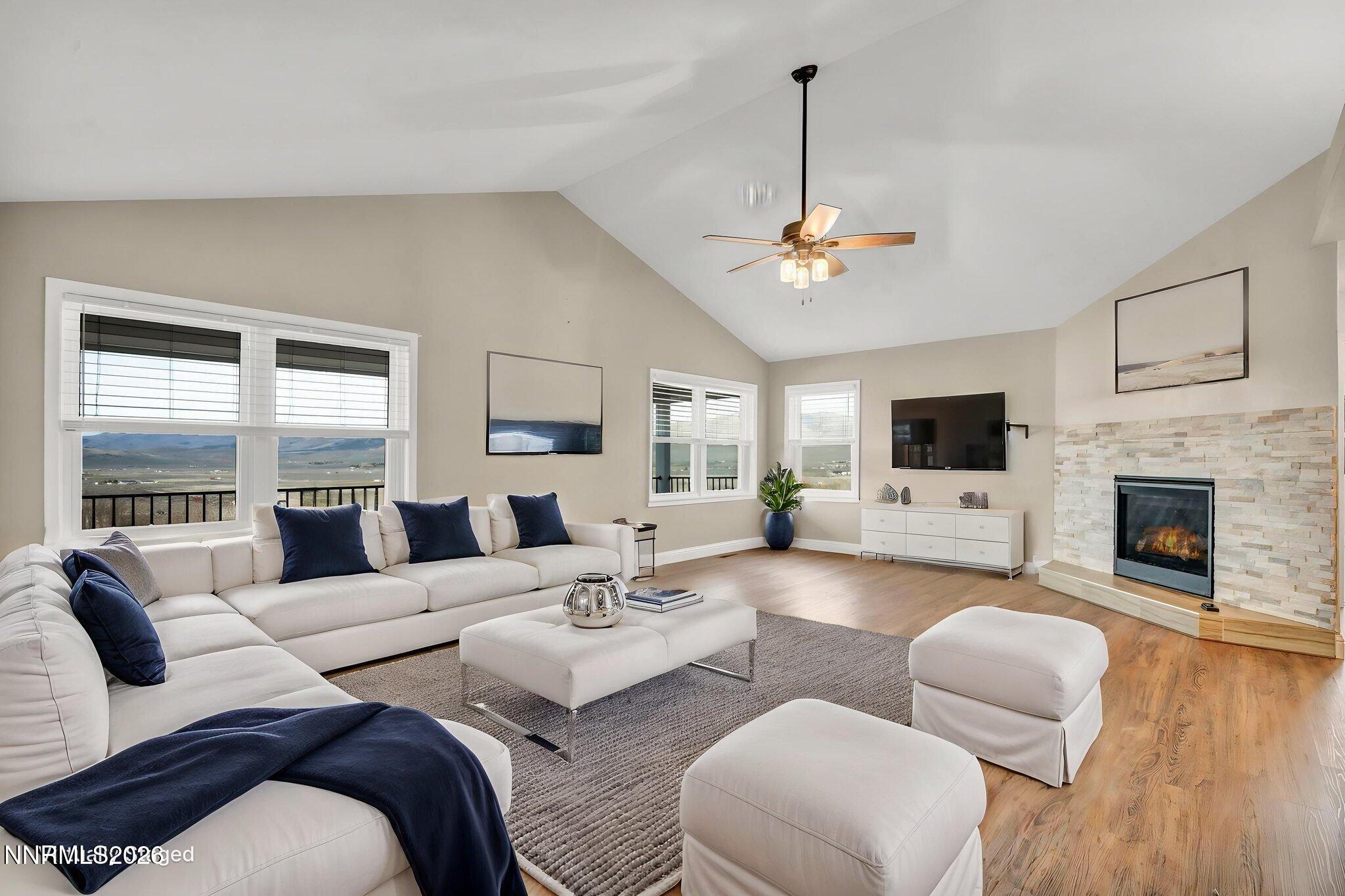 45 Arabian Way Reno, NV 89508 - Photo 42 of 44 a living room with furniture a fireplace and a flat screen tv