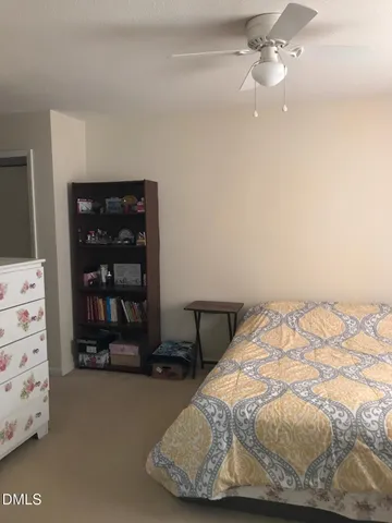 a bedroom with a bed and a cabinets